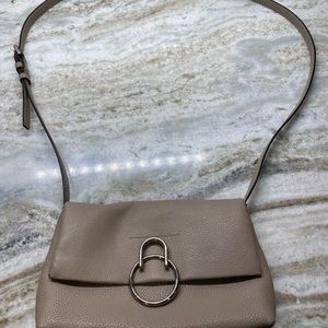 Vince Camuto pebbled leather purse with long shoulder strap.